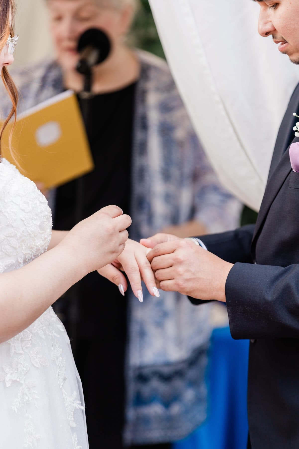 A close view of the ring exchange during the ceremony.