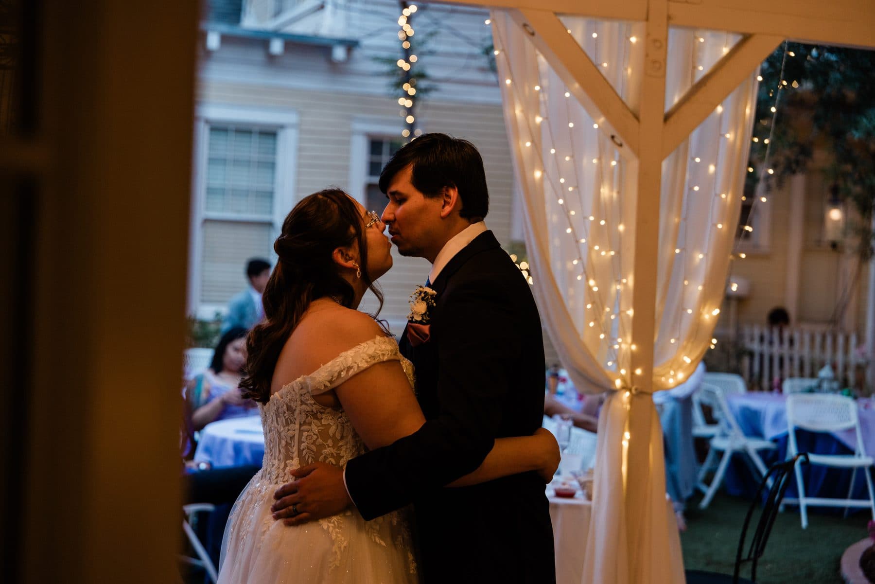 The first dance beneath a canopy of string lights.